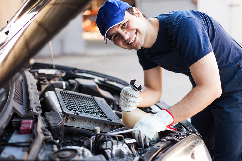 Mechanic fixing a car engine